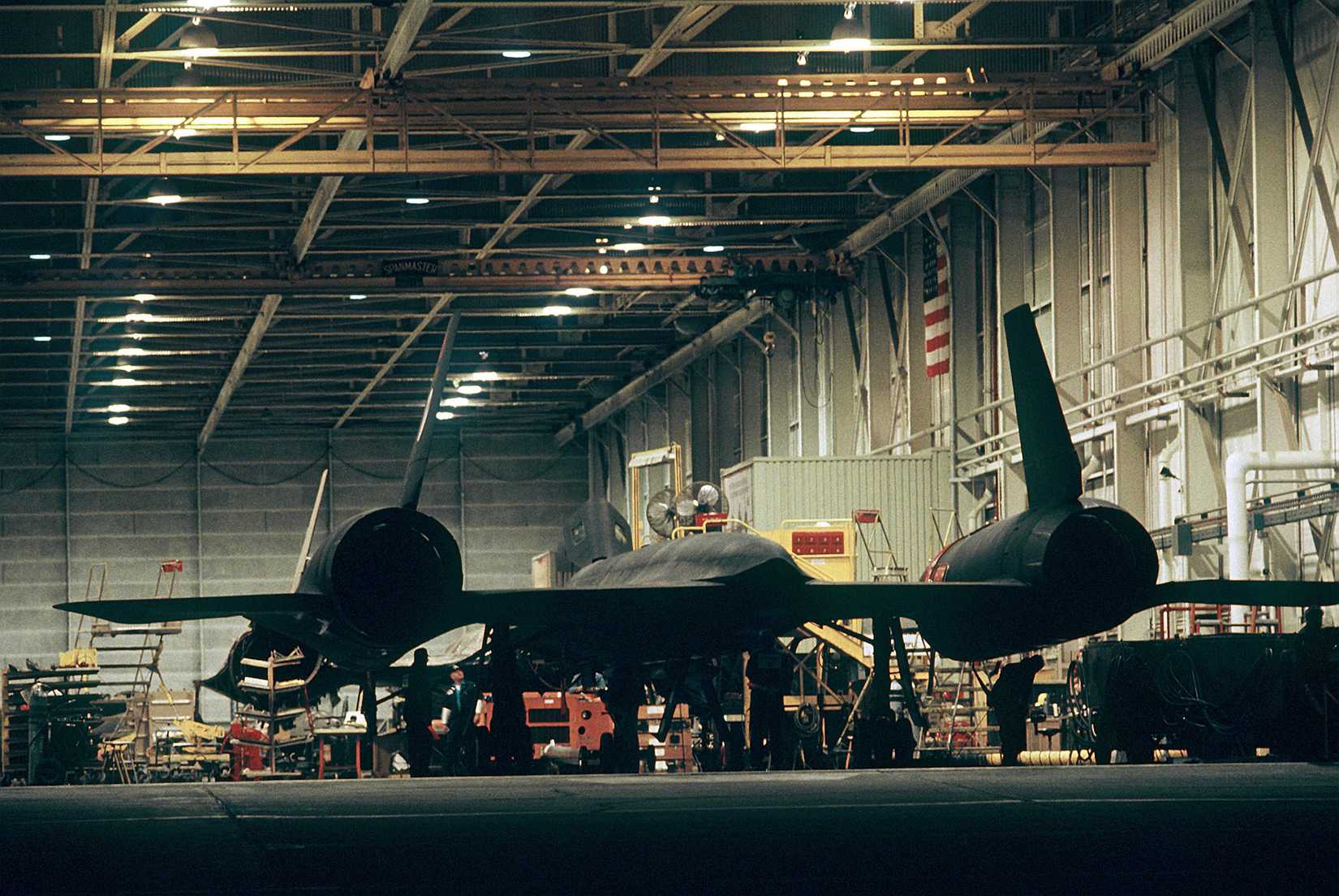 An SR-71 aircraft stands in the hangar at Lockheed Corporation headquarters prior to its recordbreaking, coast-to-coast flight.