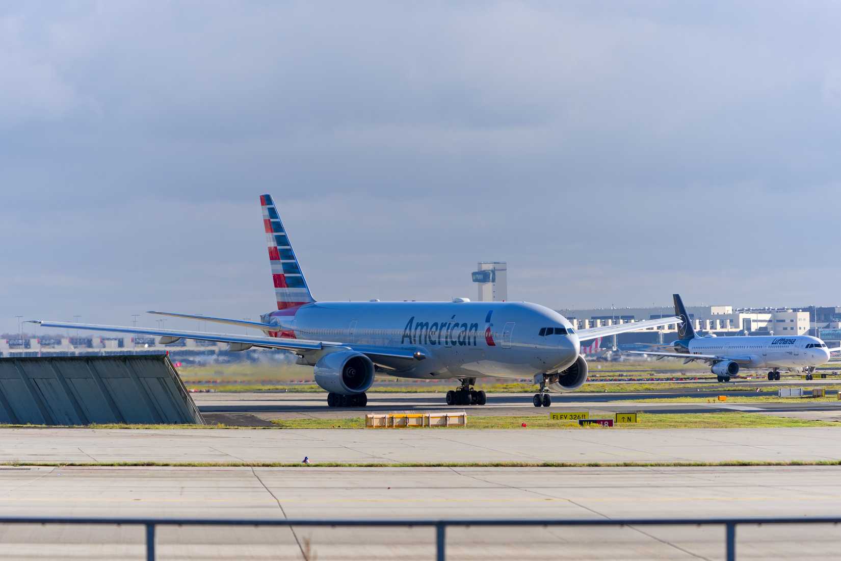 Boeing 777-200ER registration N751AN leaving Frankfurt Airport on an autumn day.