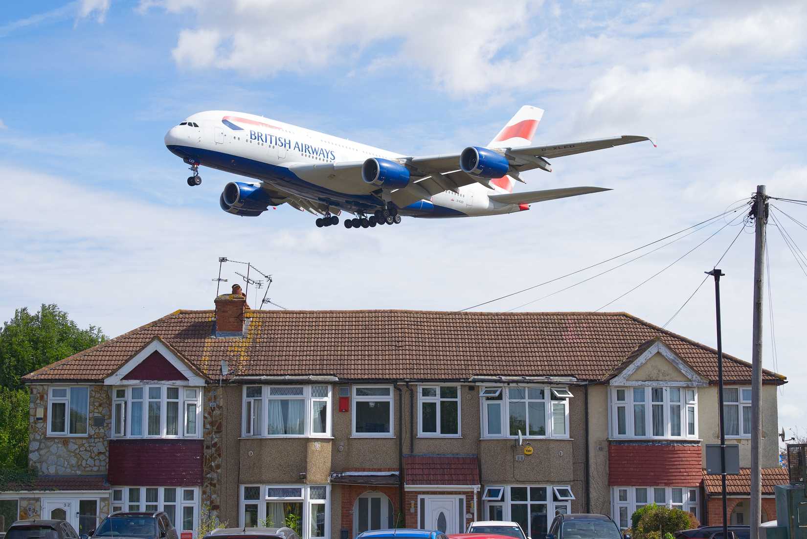 British Airways A380 plane coming into land over some residential houses. London - 9th August 2025.