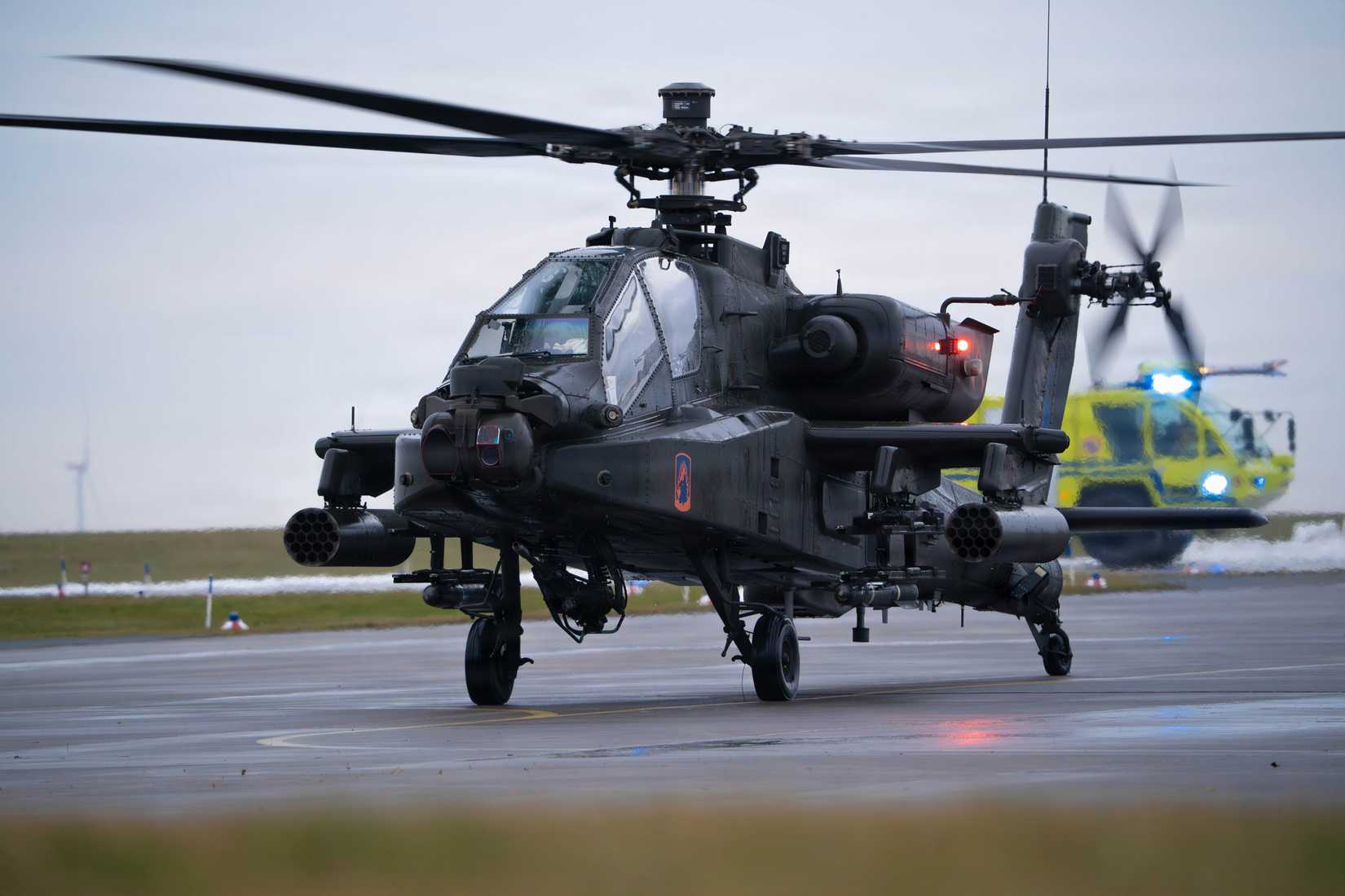 Chief Warrant Officer 3 Johnny Jenkins pilots an AH‑64E Apache helicopter
