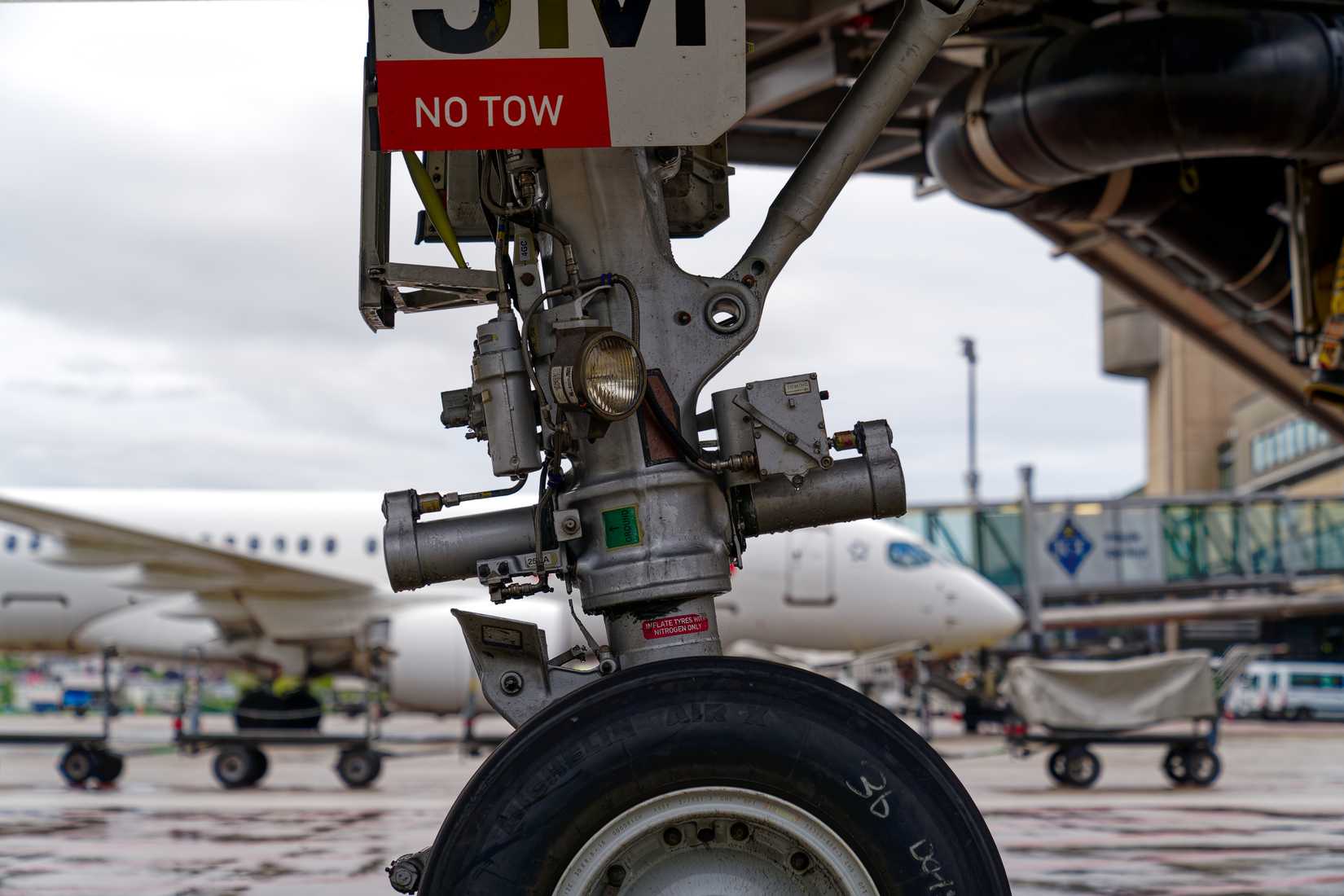 Close-up of aircraft font wheel Michelin tire of Swiss Airbus A320-200.-1
