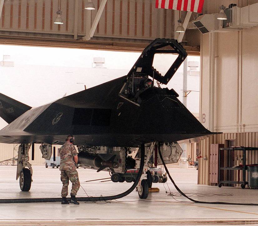 Crew members at Holloman Air Force Base, New Mexico, prepare an F-117 Nighthawk aircraft for deployment