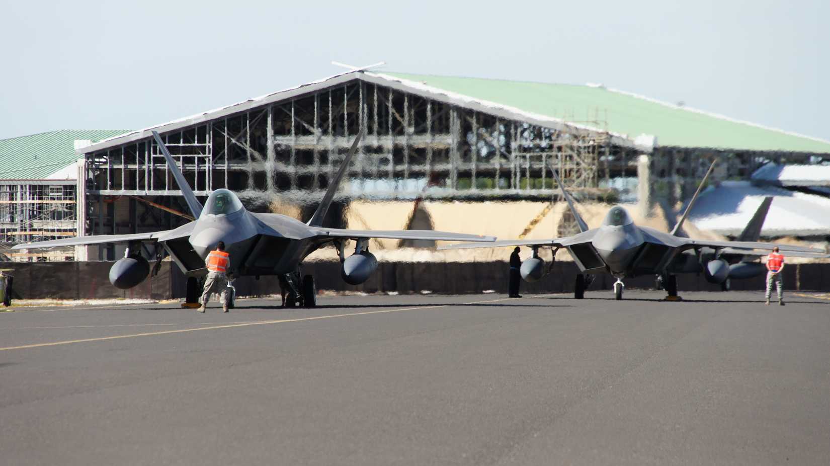 F-22s from the Hawaii Air National Guard's 199th Fighter Squadron and the active duty Air Force's 19th Fighter Squadron loaded with external fuel tanks