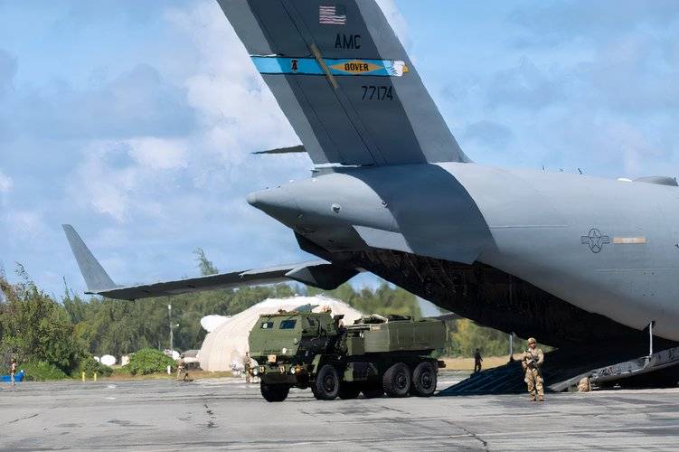 An US Army HIMARS launcher being unloaded from a C-17 on Wake Island.