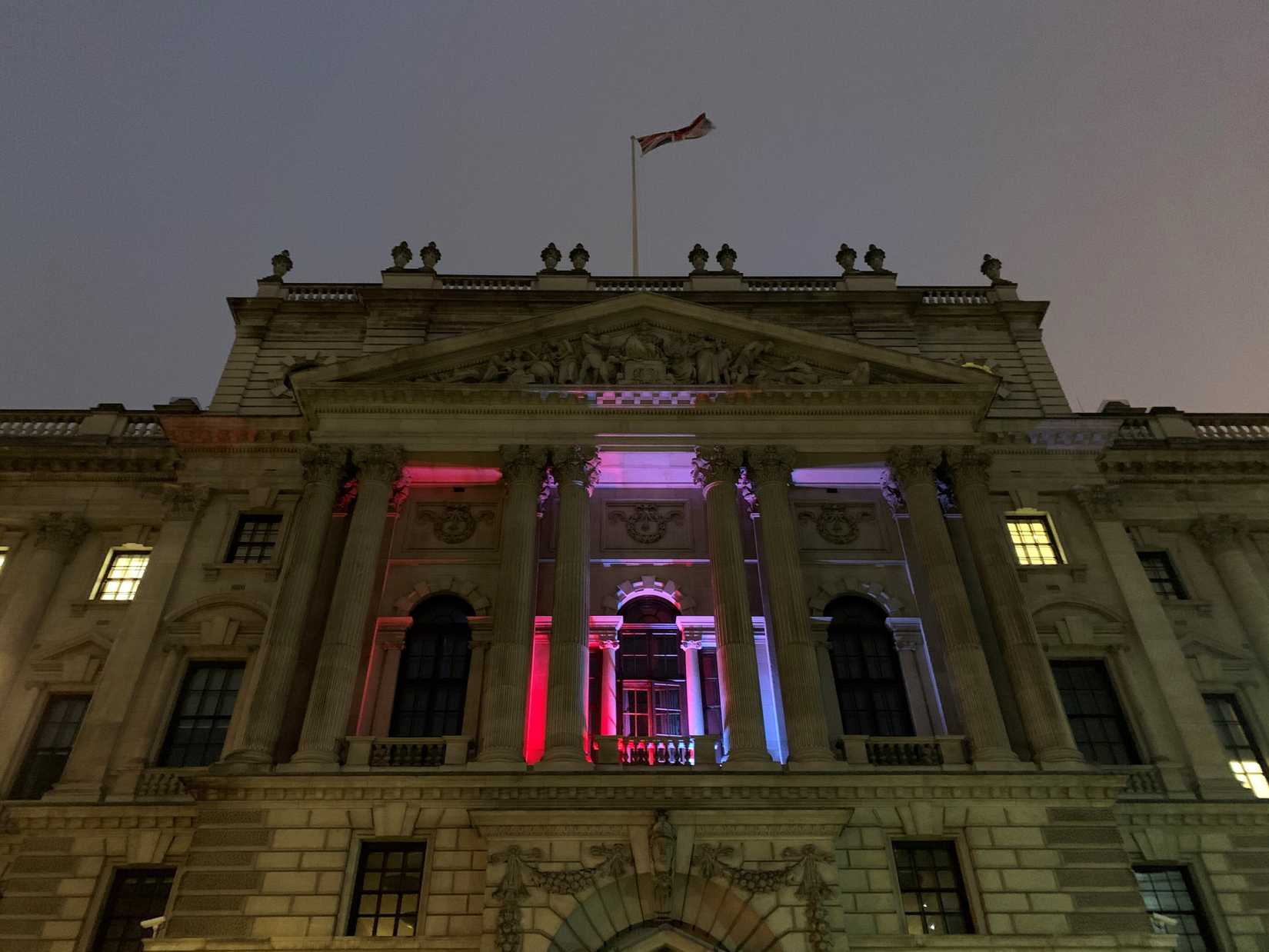 The HMRC building lit up in British colors