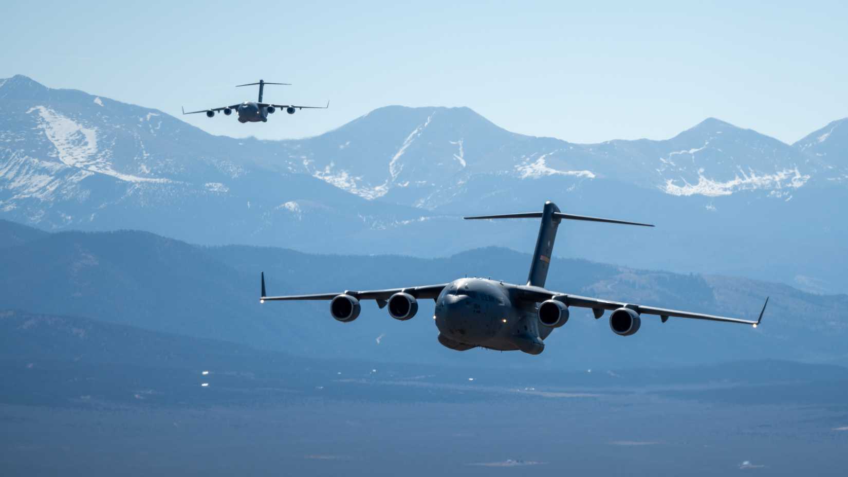 ir Force C-17 Globemaster III aircraft assigned to the 58th Airlift Squadron fly in formation over the central United States, March 27, 2026.