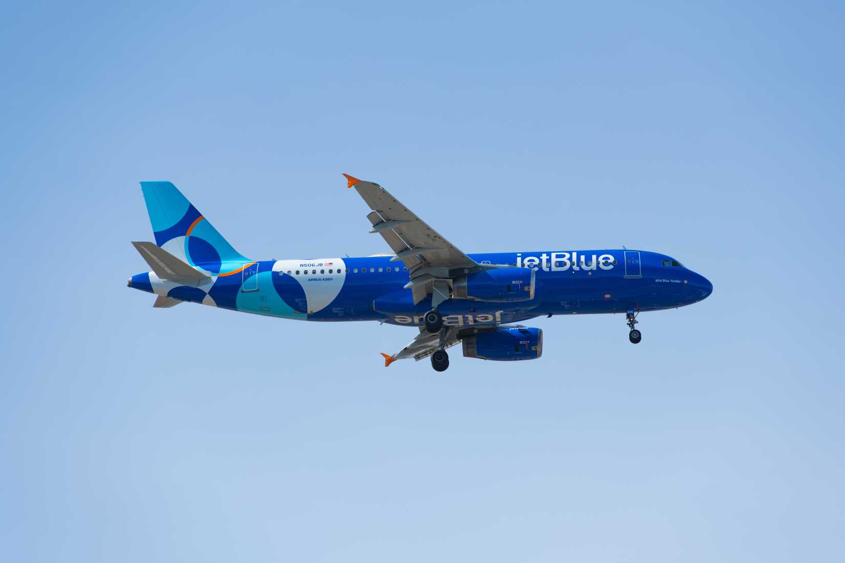 JetBlue Airbus A320 in the air blue sky
