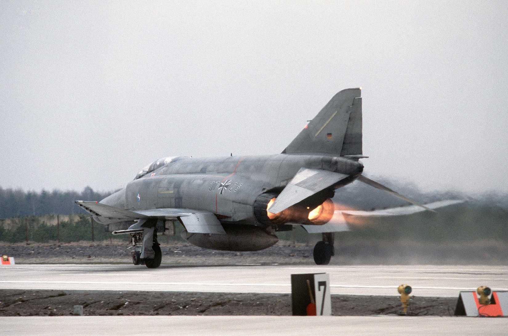 Left rear view of a West German F-4 Phantom II aircraft taking off from the autobahn.