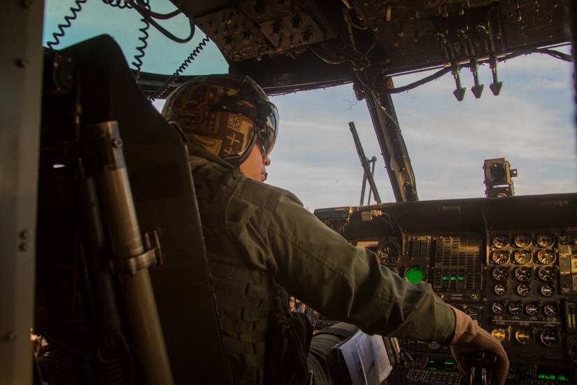 Major Anthony Quitugua, Marine Heavy Helicopter Training Squadron 302, co-pilots a CH-53 Super Stallion helicopter.