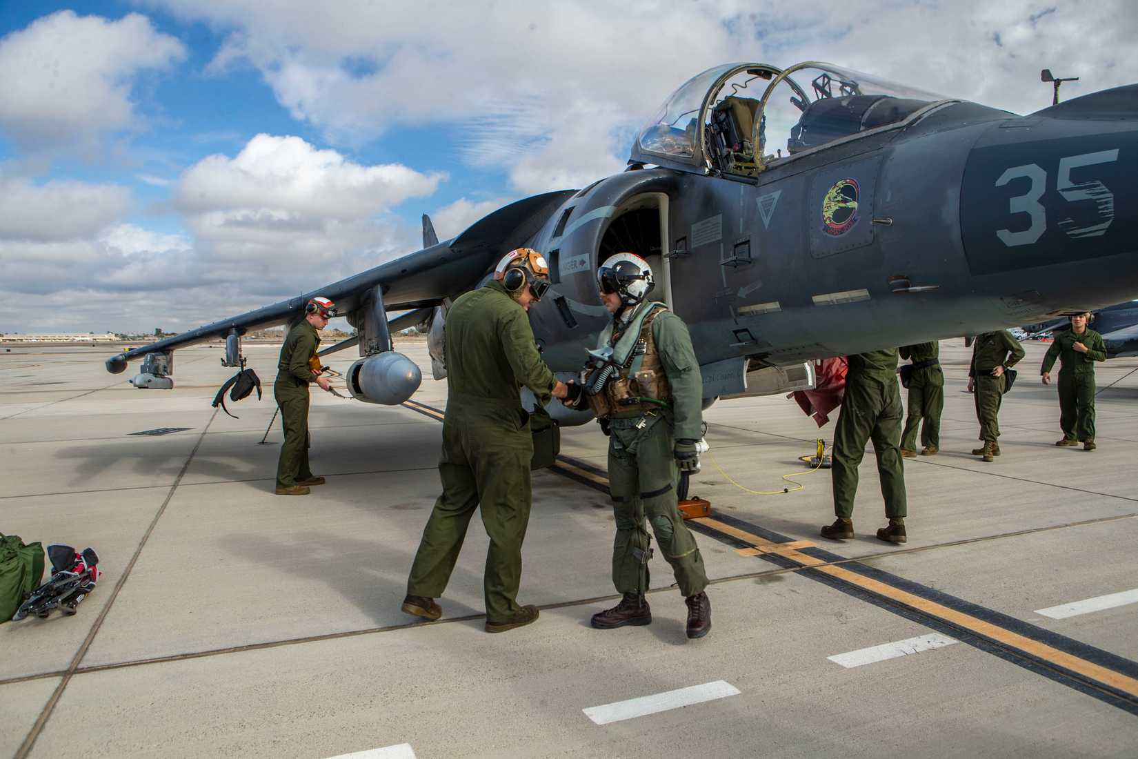 Major Johnathan Walker, an instructor pilot, shakes hands with a Marine upon arrival at Marine Corps Air Station Yuma, Arizona, Jan. 21, 2021.