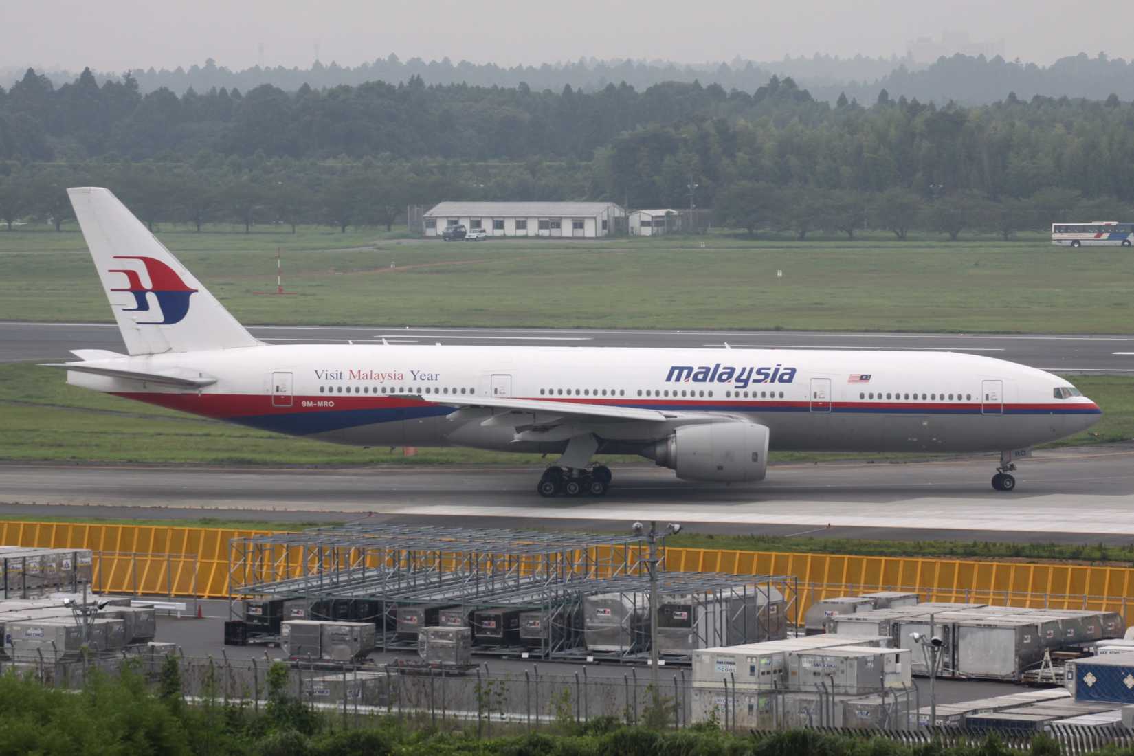 A Boeing 777-2H6ER aircraft (9M-MRO) of Malaysia Airlines holding short of runway 16R at Narita International Airport in Tokyo on 2 August 2009.
