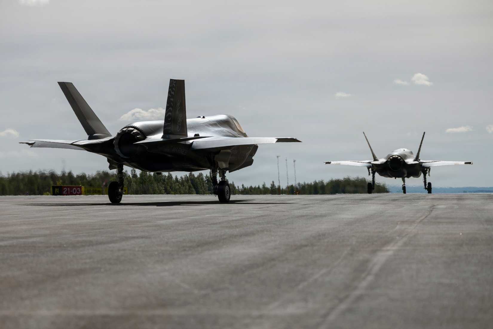 Marine Corps F-35B Lightning II aircraft with Marine Fighter Attack Squadron (VMFA) 224, Marine Aircraft Group 31, 2nd Marine Aircraft Wing, taxi down a flightline.