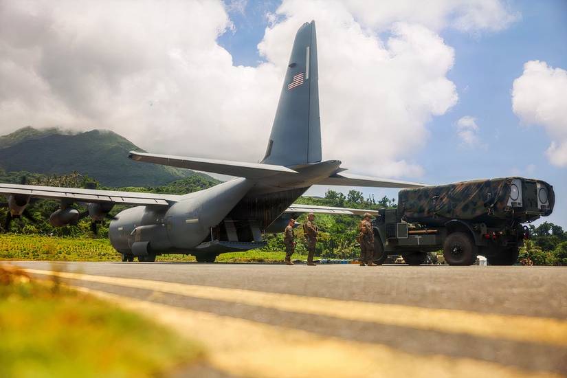 Marines unload a mobile NEMSIS missile launcher from a C-130.