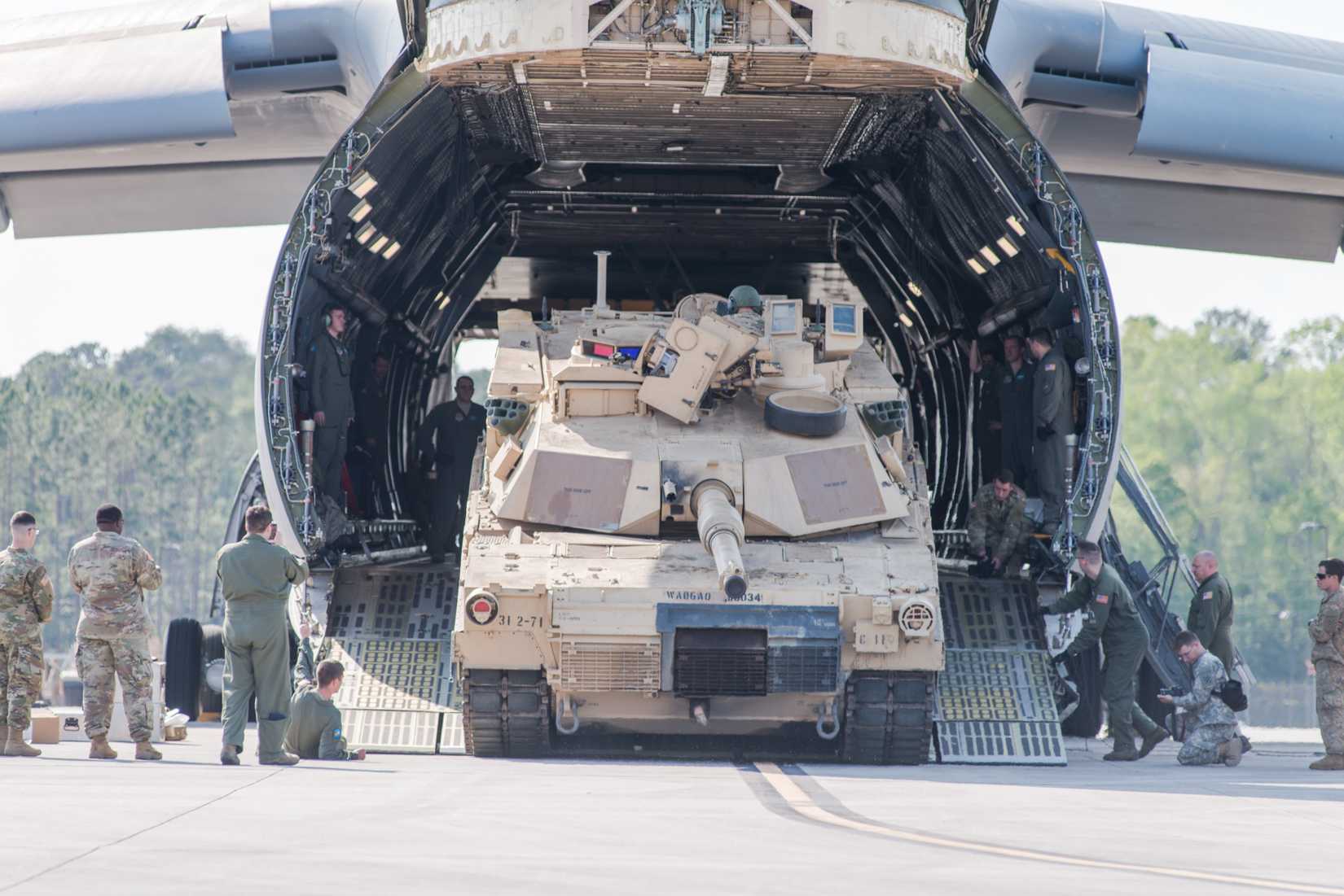 oldiers of the 2nd Battalion, 7th Infantry Regiment, 1st Armored Brigade Combat Team, 3rd Infantry Division load a M1A1 Abrams tank onto a C5 %22Super Galaxy.%22