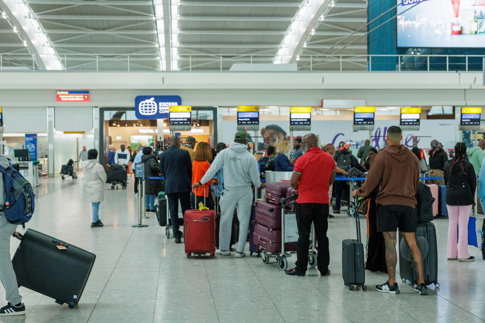 Passengers lined up at London Heathrow Airport