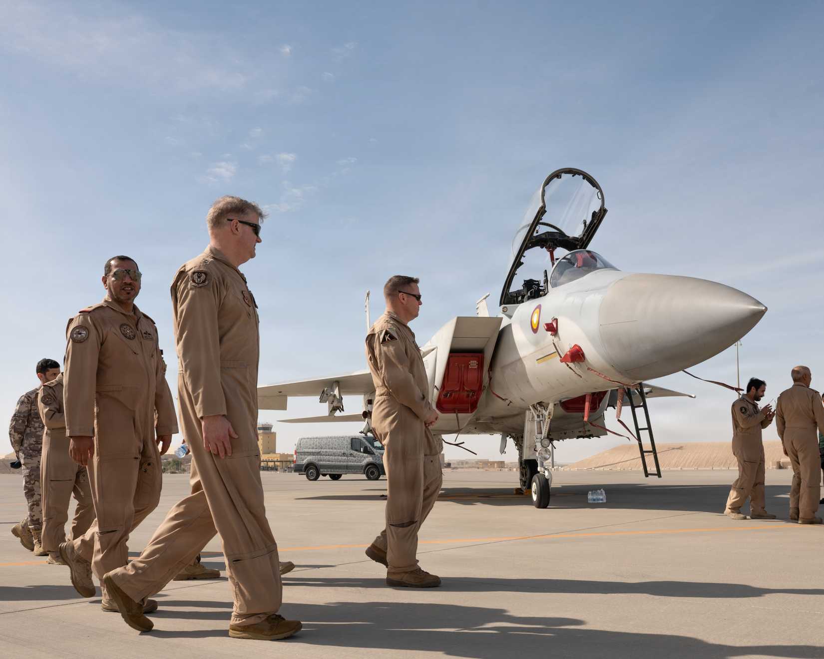 Qatar Emiri Air Force and U.S. Air Force leaders walk and chat while visiting aircraft static displays during Partnership Day at Al Udeid Air Base, Qatar, Feb. 11, 2026.