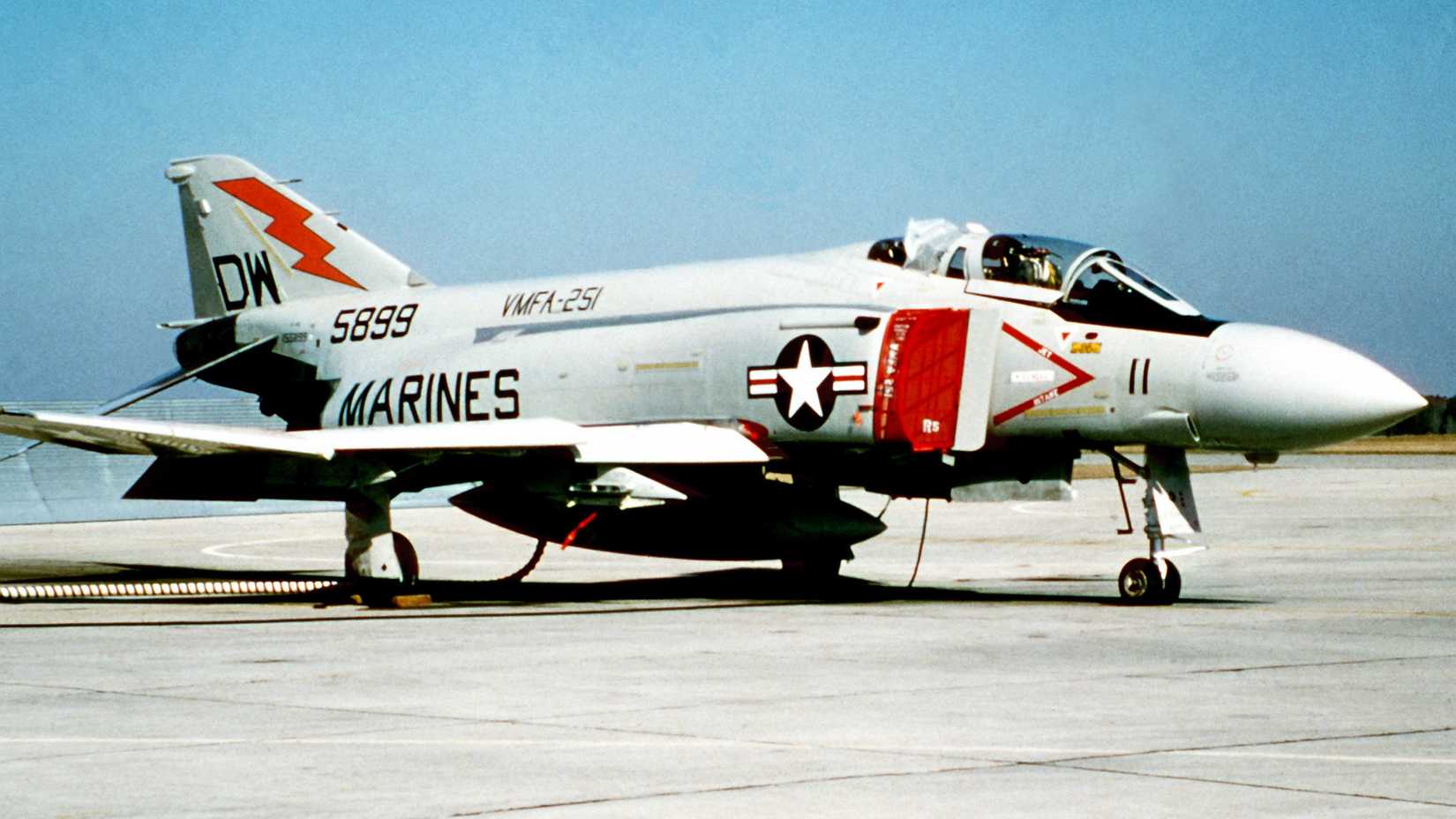 Right front view of a Marine F-4 Phantom aircraft sitting on the flight line. The F-4 is from Marine Fighter Attack Squadron 251 (VMFA-251).