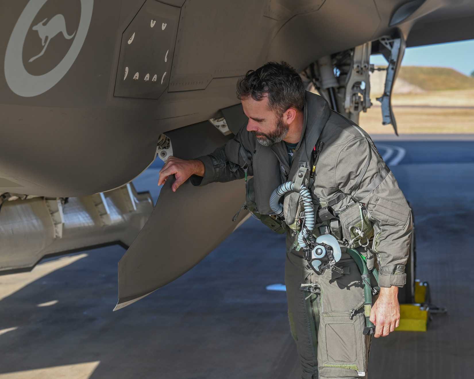 Royal Air Force Squadron Leader Daniel “Goffy” Goff, F-35B instructor pilot, performs preflight checks on a Royal Australian Air Force F-35A Lightning I