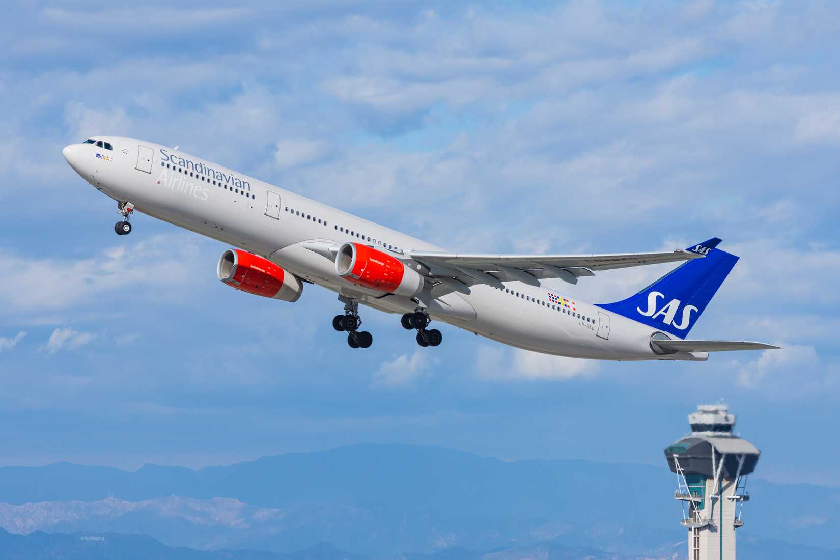 SAS Scandinavian Airlines Airbus A330 is rocketing off from Los Angeles International Airport (LAX).