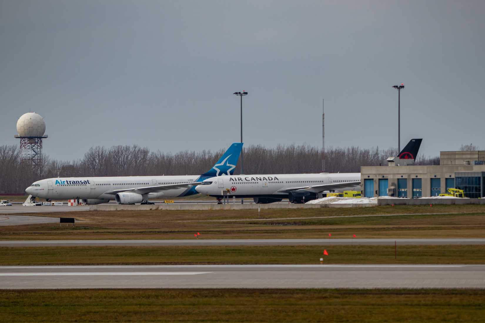  Two Airbus A330, one Air Canada the other Air Transat, parked at Montreal Airport