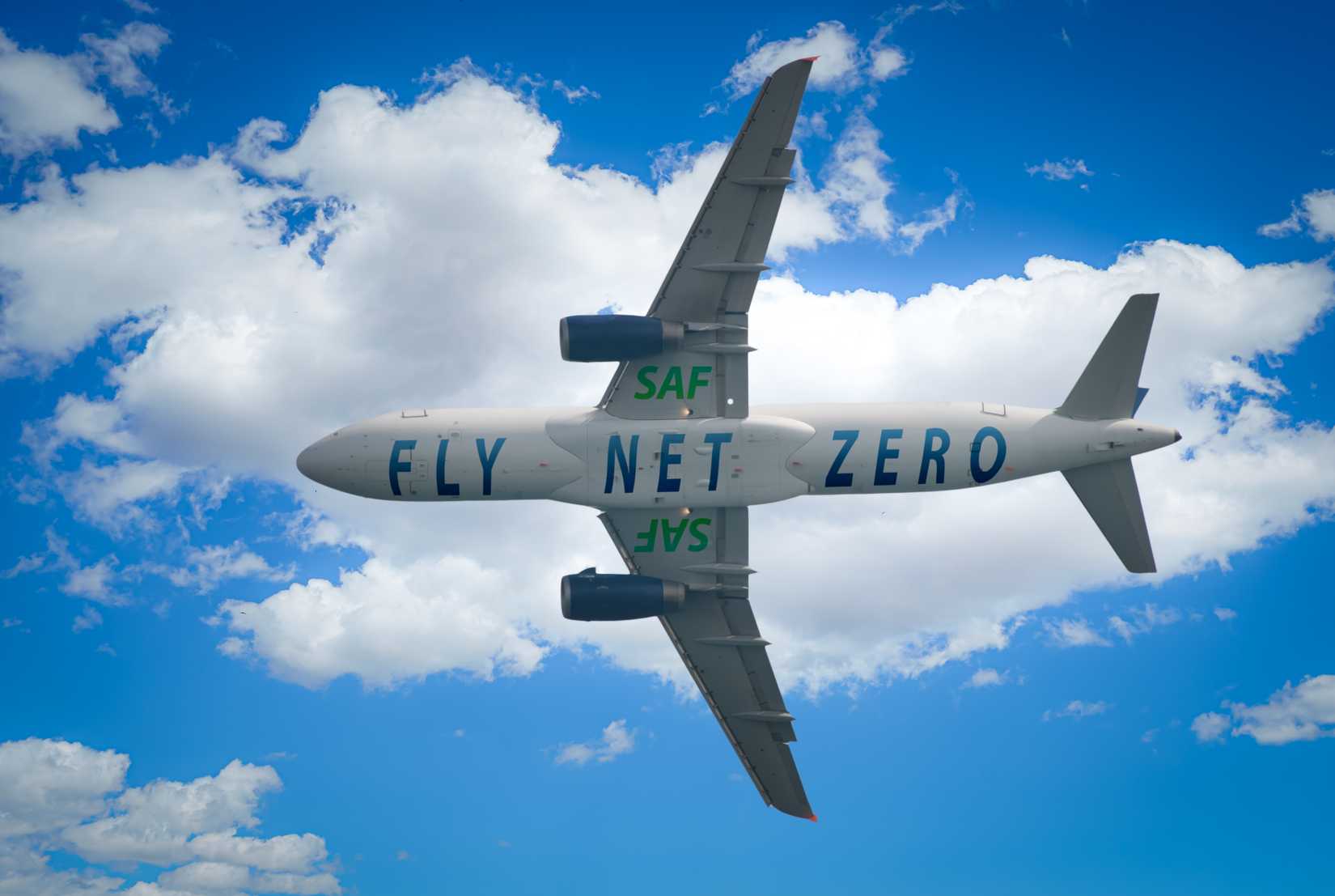 A commercial aircraft displaying “Fly Net Zero” branding