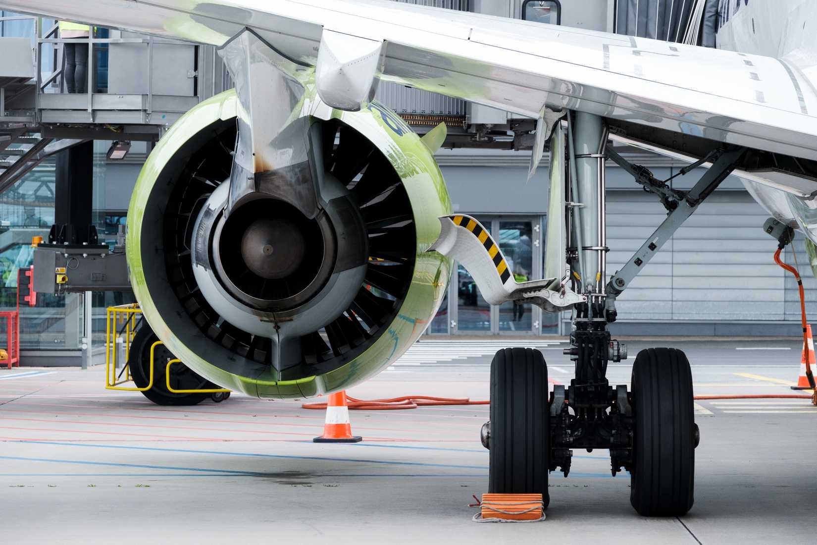 An Airbaltic Airbus A220-300 equipped with a Pratt Whitney PW1500G engine
