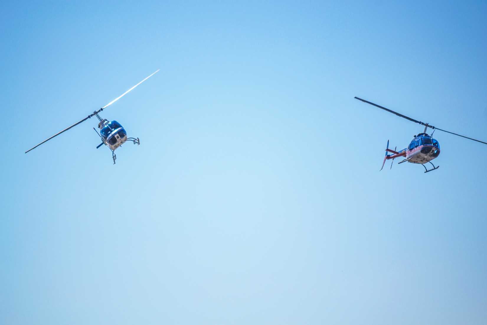 Two Bell-206 performing aerobatic flights and the limit low altitude at an airshow in Bulgaria