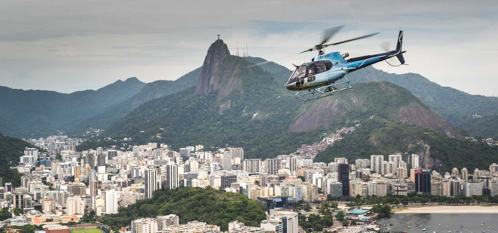 An Aérospatiale AS 350B2 Ecureuil helicopter flight over the city circa 2017, in Rio de Janeiro.
