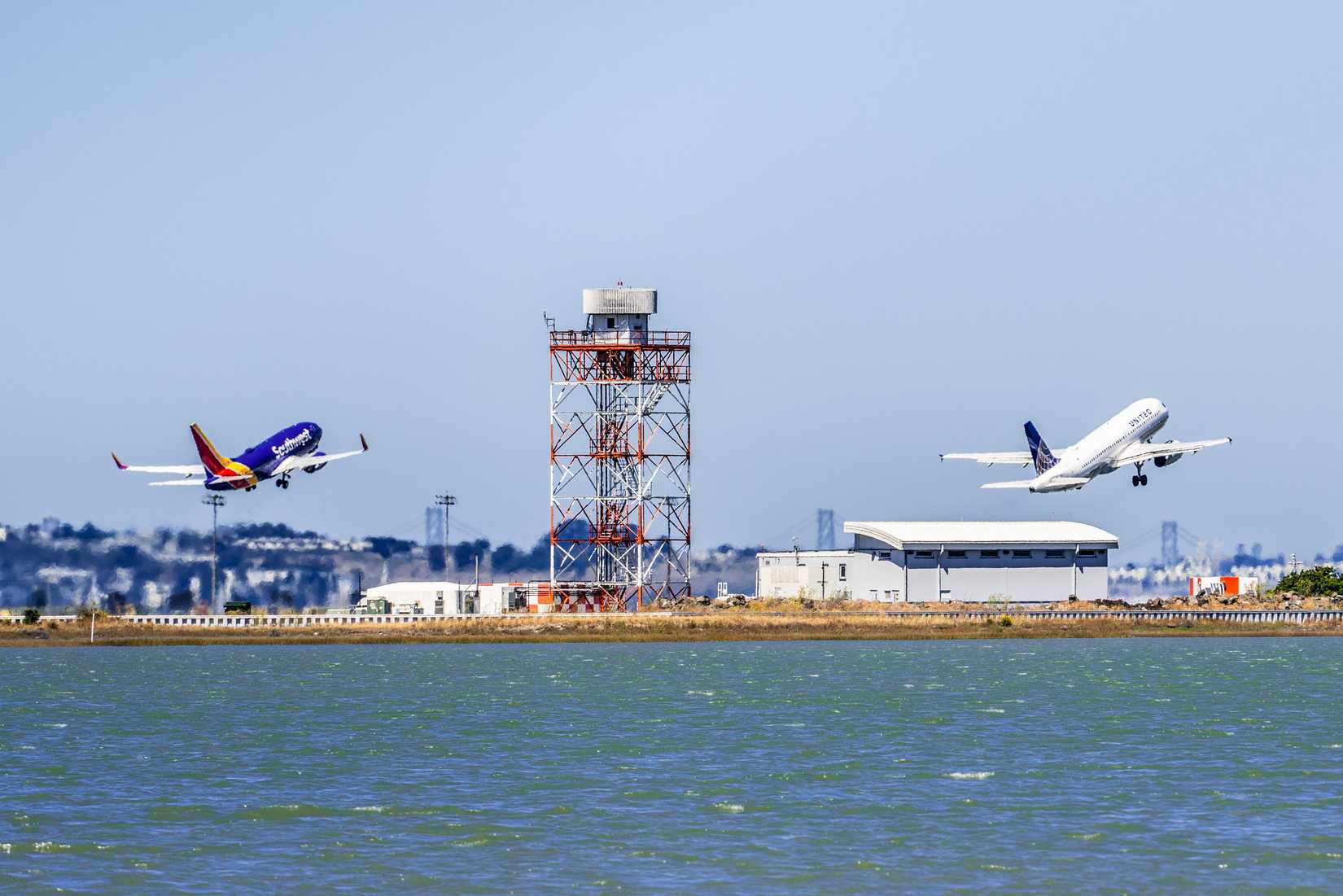 Southwest Airlines and United Airlines taking off at the same time from San Francisco International Airport (SFO).