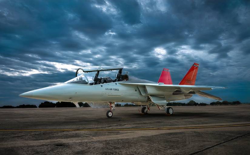 Photo of a T-7 parked at dusk against a cloudy sky.