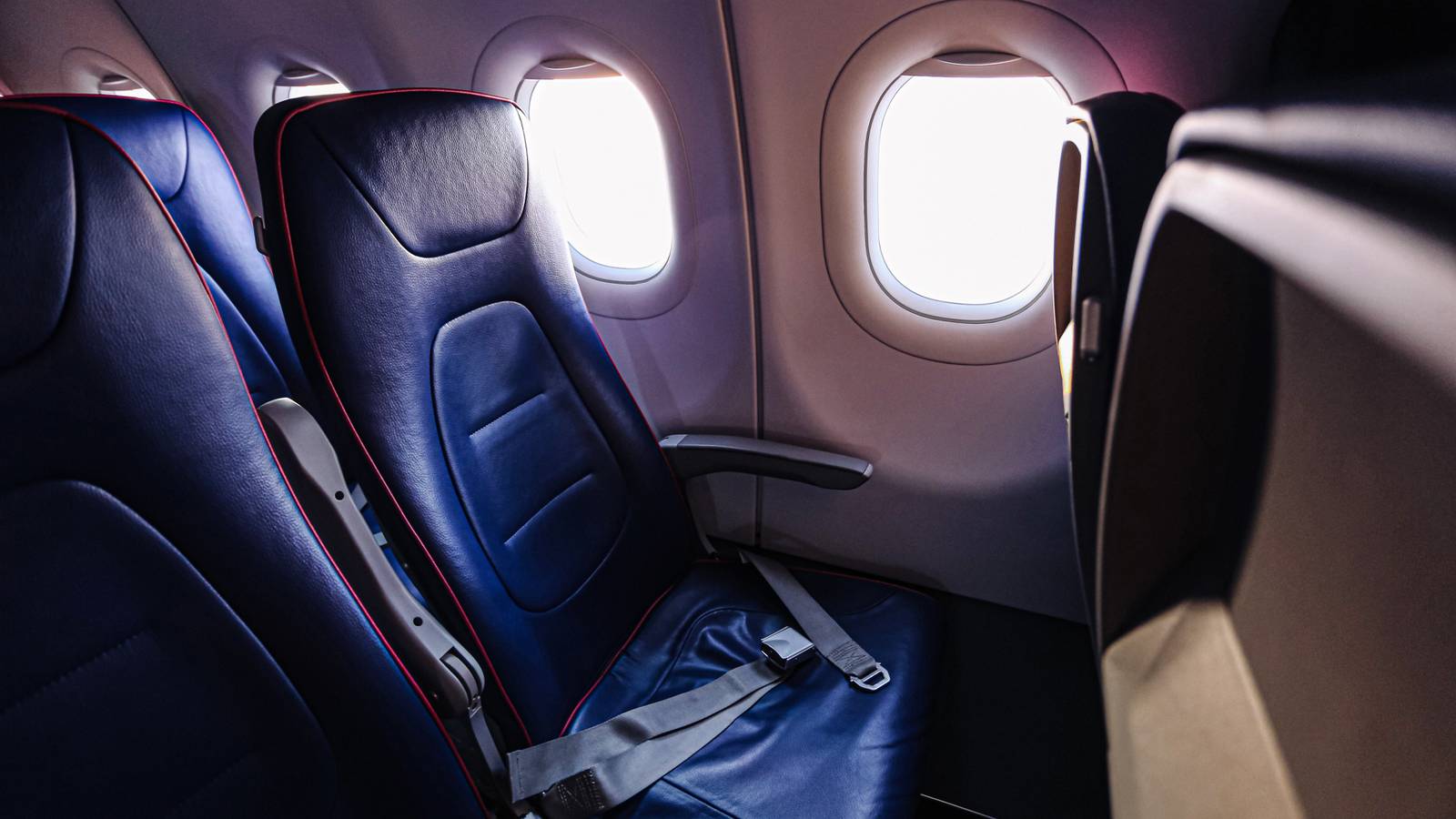 The Armrest Trick Flight Attendants Use & The Safety Rule Behind It