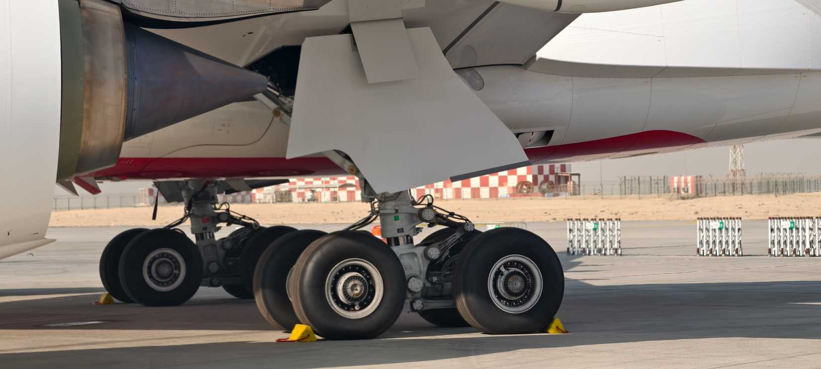 The robust main landing gear of an Airbus A350-900 aircraft.
