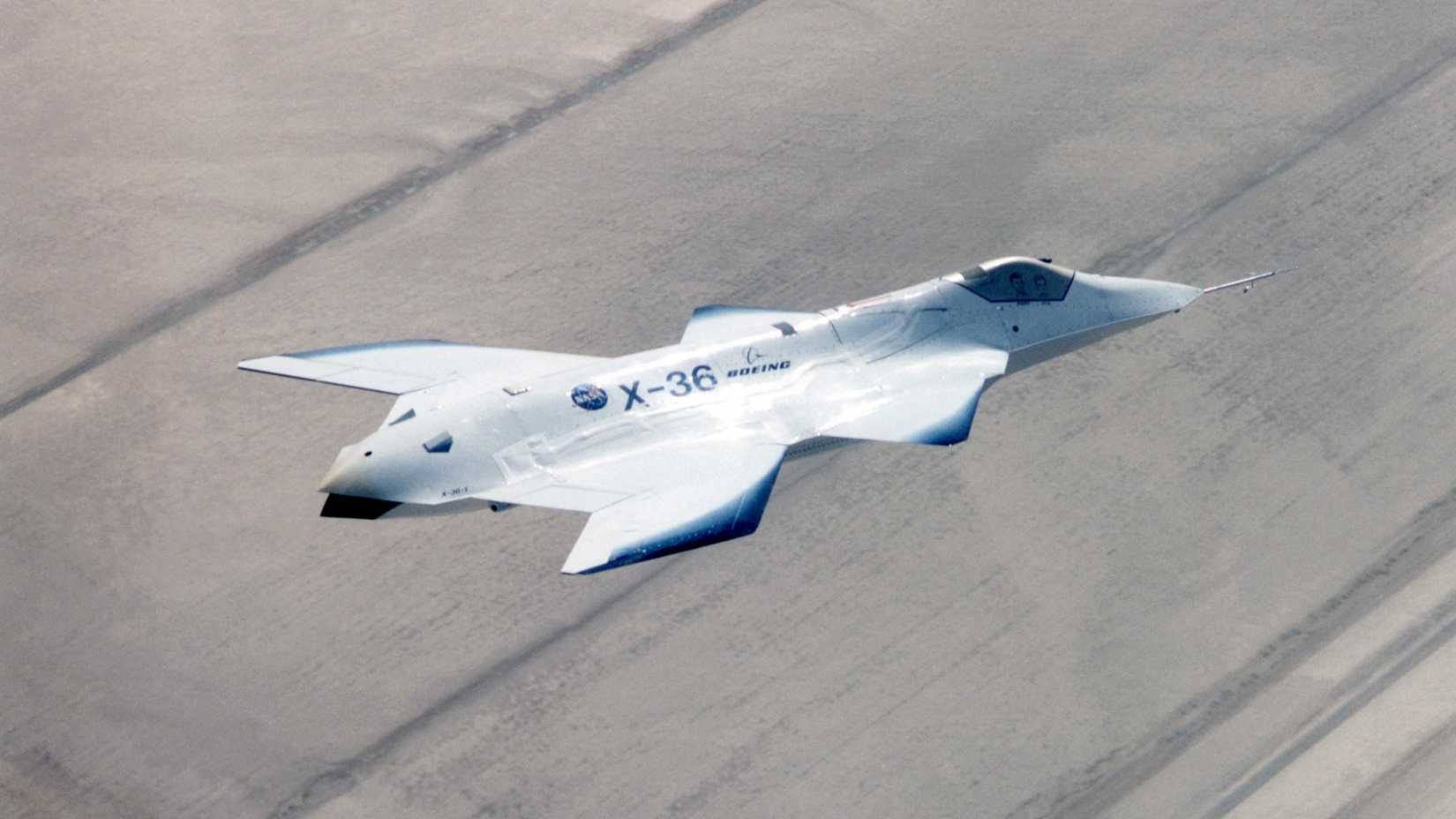The X-36 technology demonstrator shows off its distinctive shape as the remotely piloted aircraft flies a research mission over the Southern California desert on October 30, 1997.