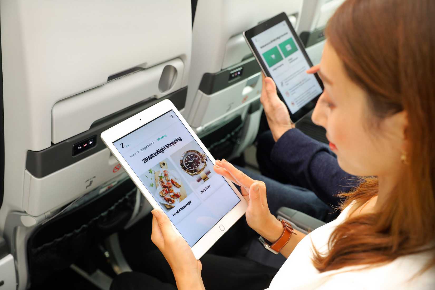 ZIPAIR passenger using iPad