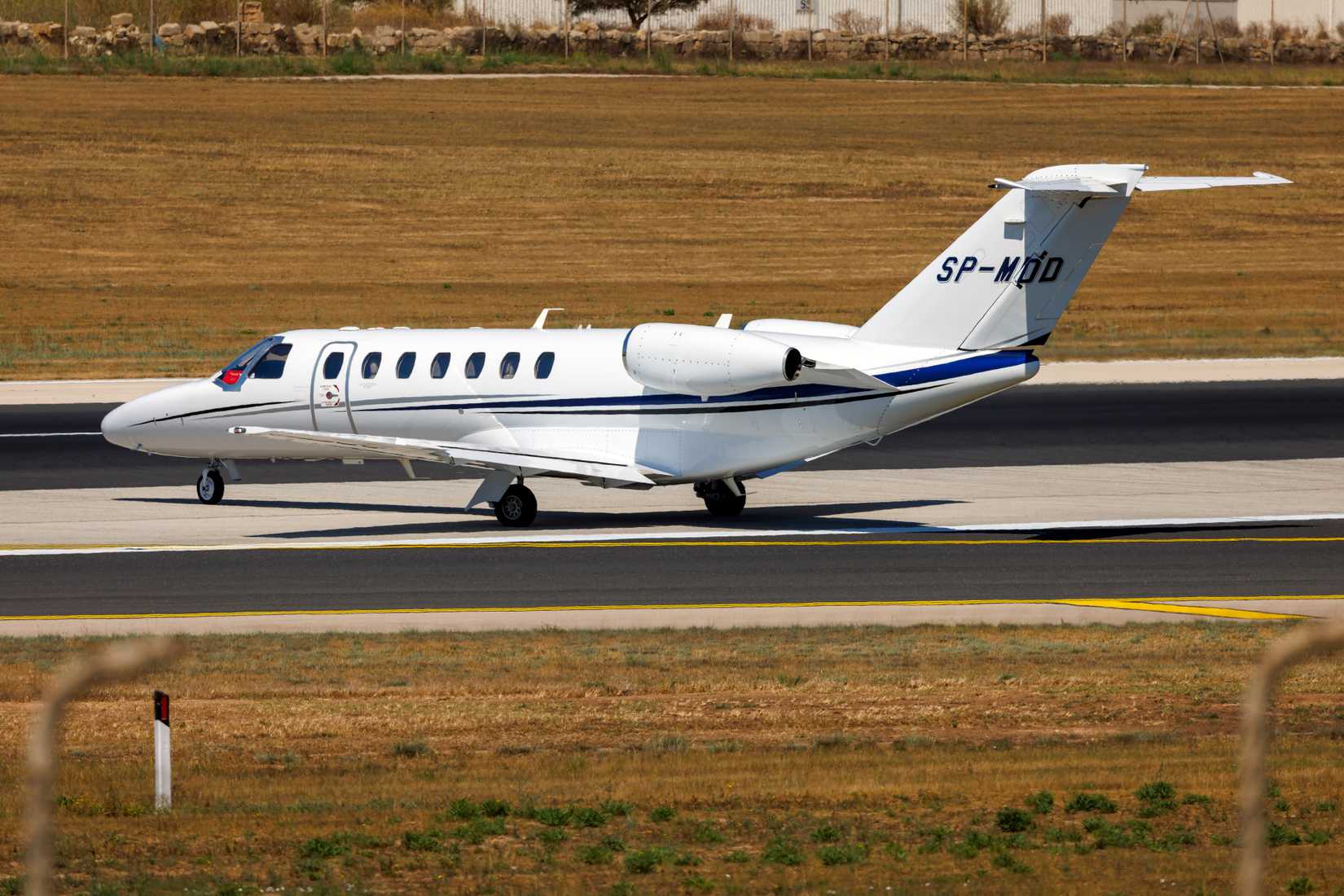 Zondajet Cessna 525B Citation CJ3+ (Reg.: SP-MDD) exiting from taxiway Charlie onto Malta runway 31 for take off.