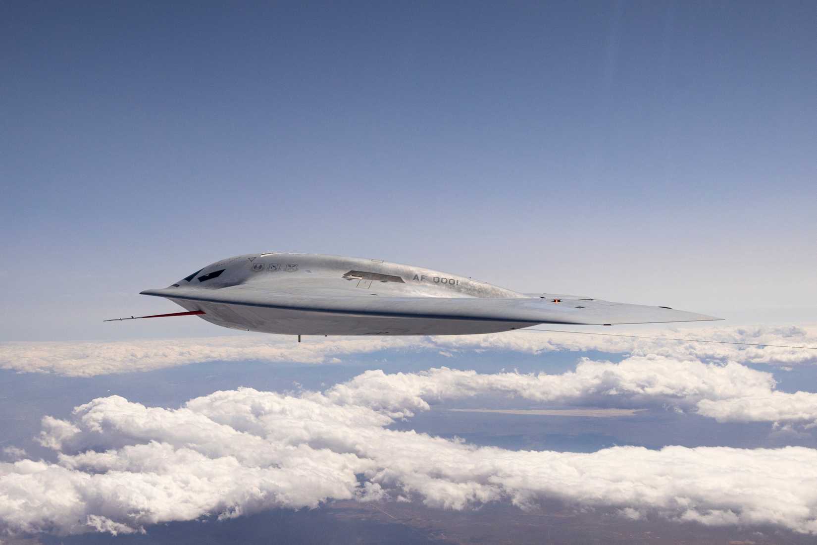 A B-21 Raider conducts flight testing, which includes ground testing, taxiing, and flying operations, at Edwards Air Force Base