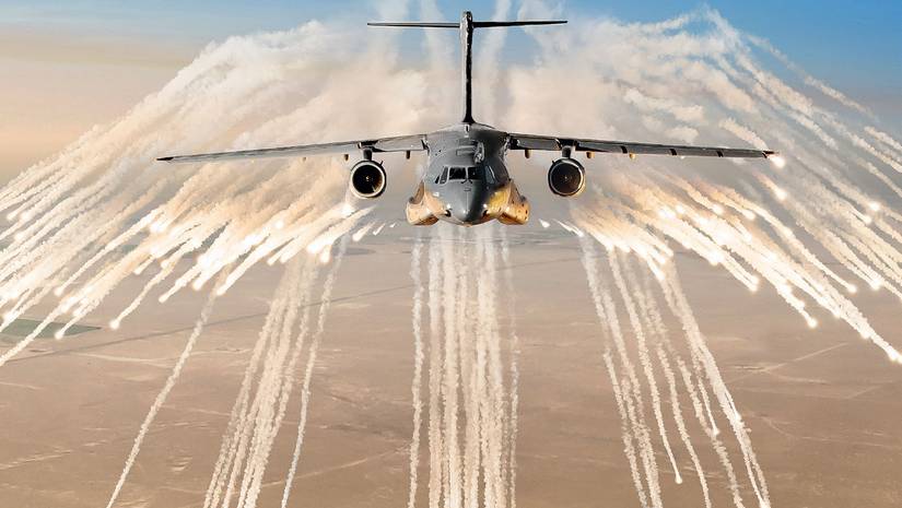 A Embraer KC-390 Millenium deploys chaff and flare countermeasures