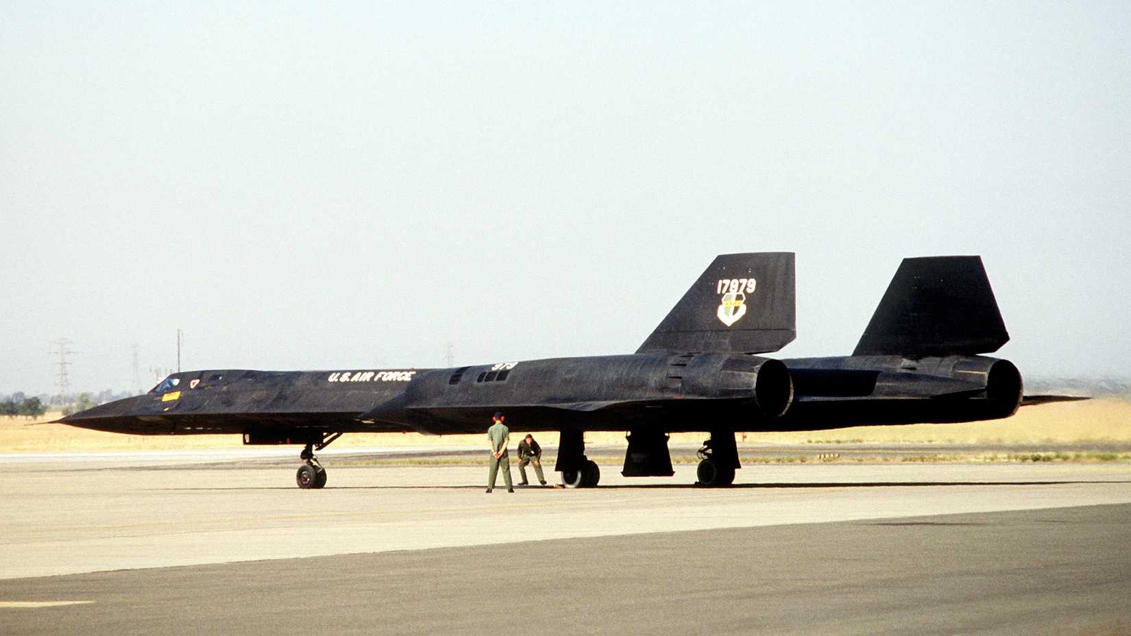 A left rear view of a parked SR-71 Blackbird aircraft from the 9th Strategic Reconnaissance Wing