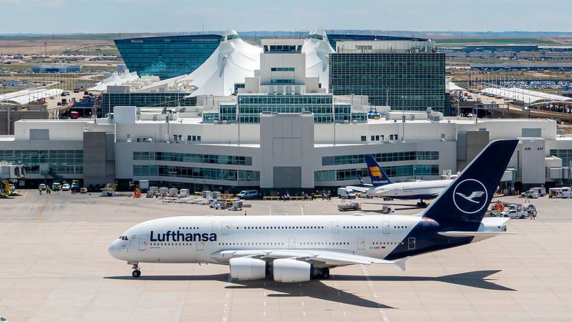 A Lufthansa A380 taxis past the distinctive DEN terminal building-1