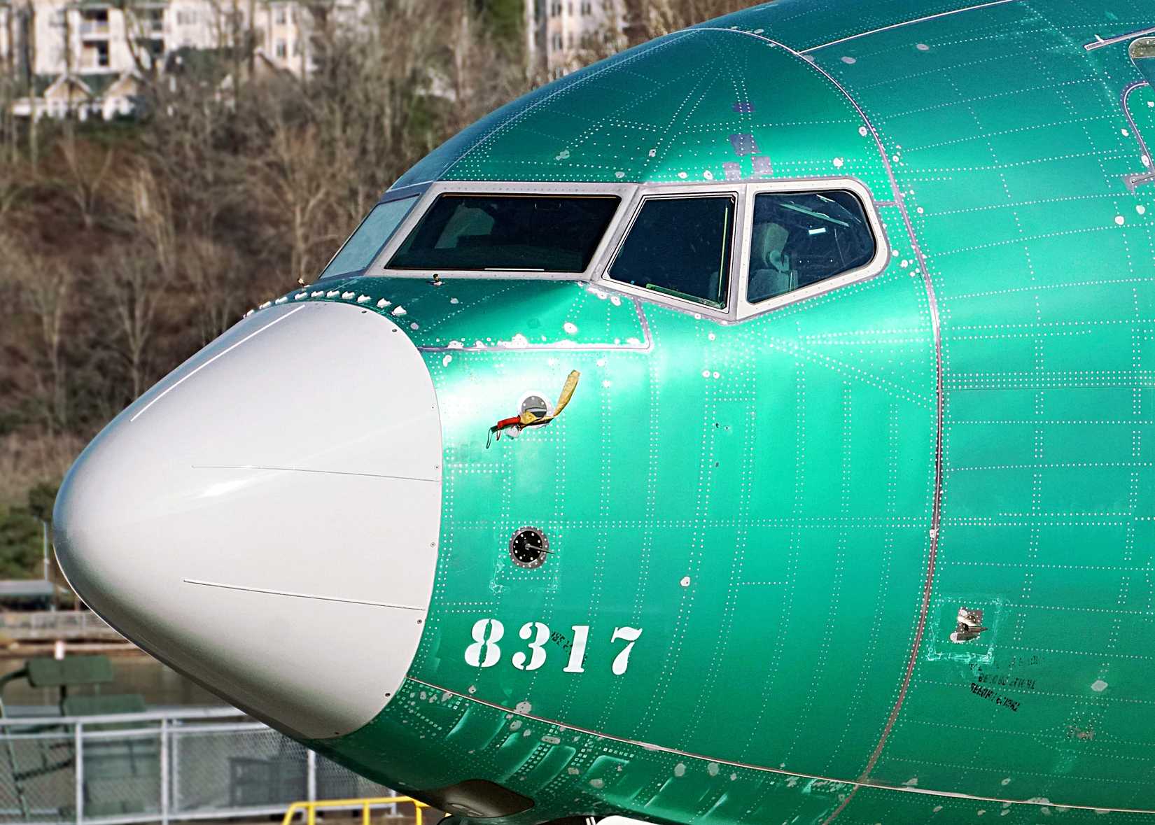 A recently-built Boeing 737 MAX sits outside the Boeing factory ahead of painting and delivery