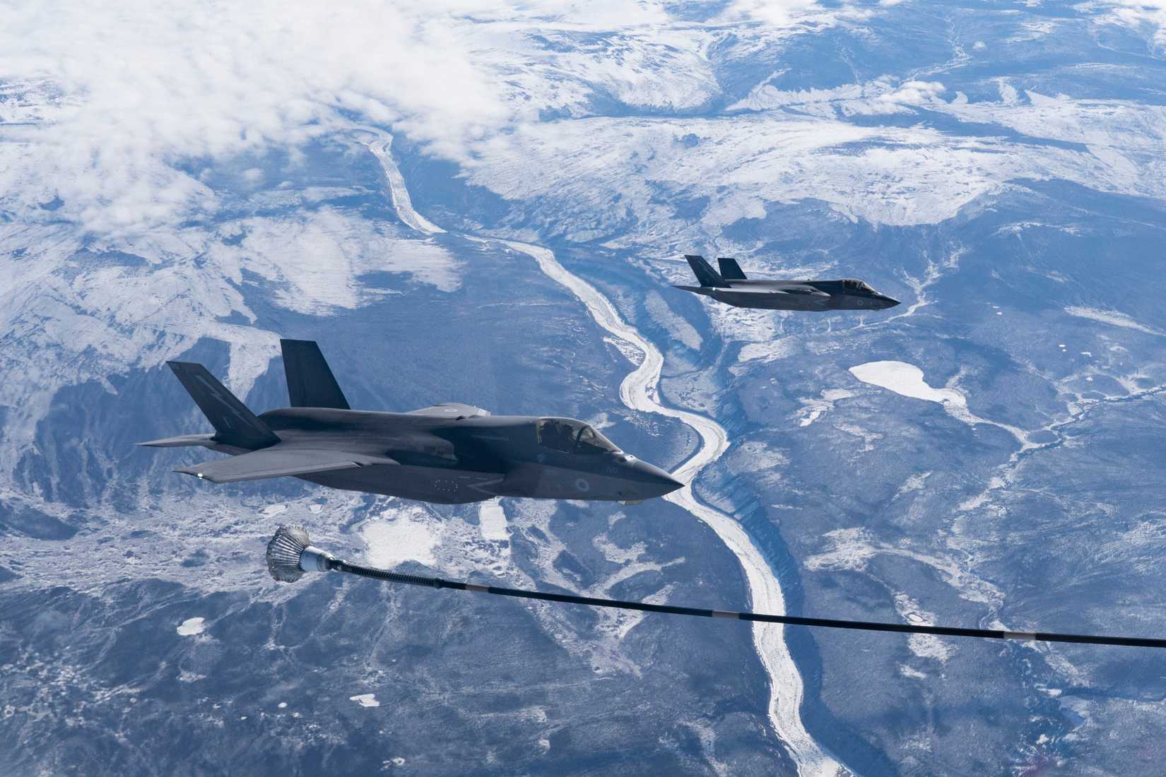 A Royal Air Force (RAF) F-35B Lightning assigned to No. 617 Squadron, receives fuel from a RAF KC-30 Voyager during Northern Edge 23-1