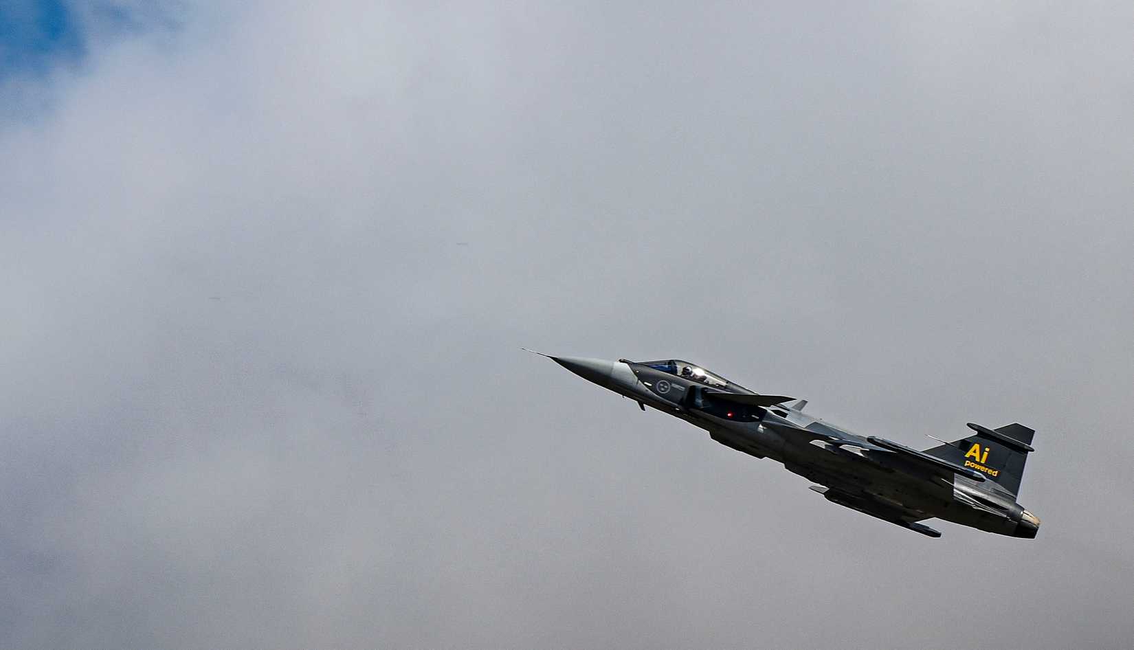 A Swedish Saab JAS 39E Gripen flies towards the clouds during the Royal International Air Tattoo at RAF Fairford, England, July 18, 2025