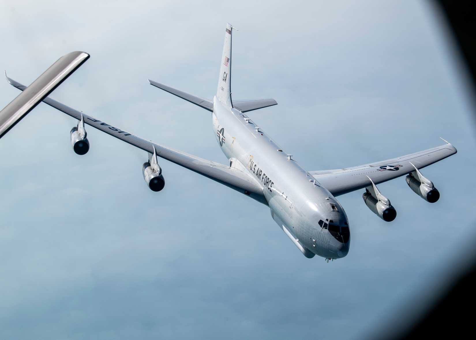 A U.S. Air Force E-8C Joint Surveillance Target Attack Radar System pulls away from a U.S. Air Force KC-135 Stratotanker