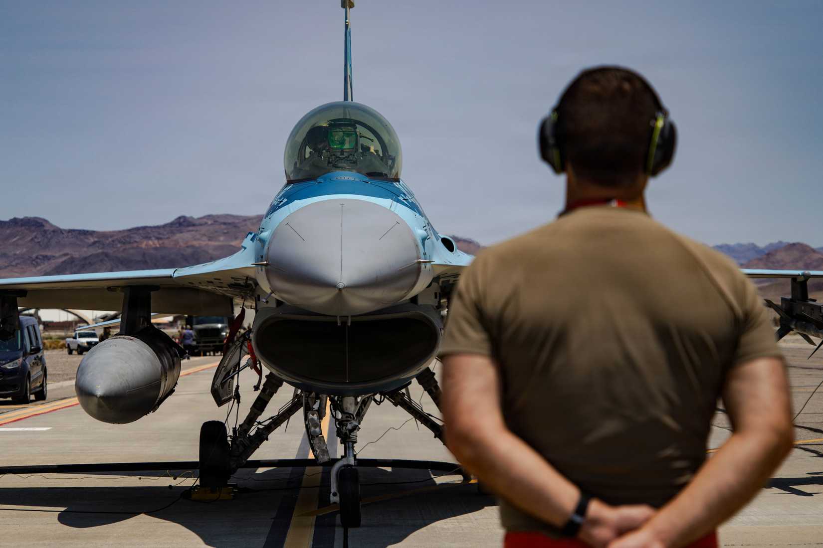 A U.S. Air Force F-16C Fighting Falcon aircraft assigned to the 64th Aggressor Squadron prepares to taxi onto the runway during exercise VENOM FORGE
