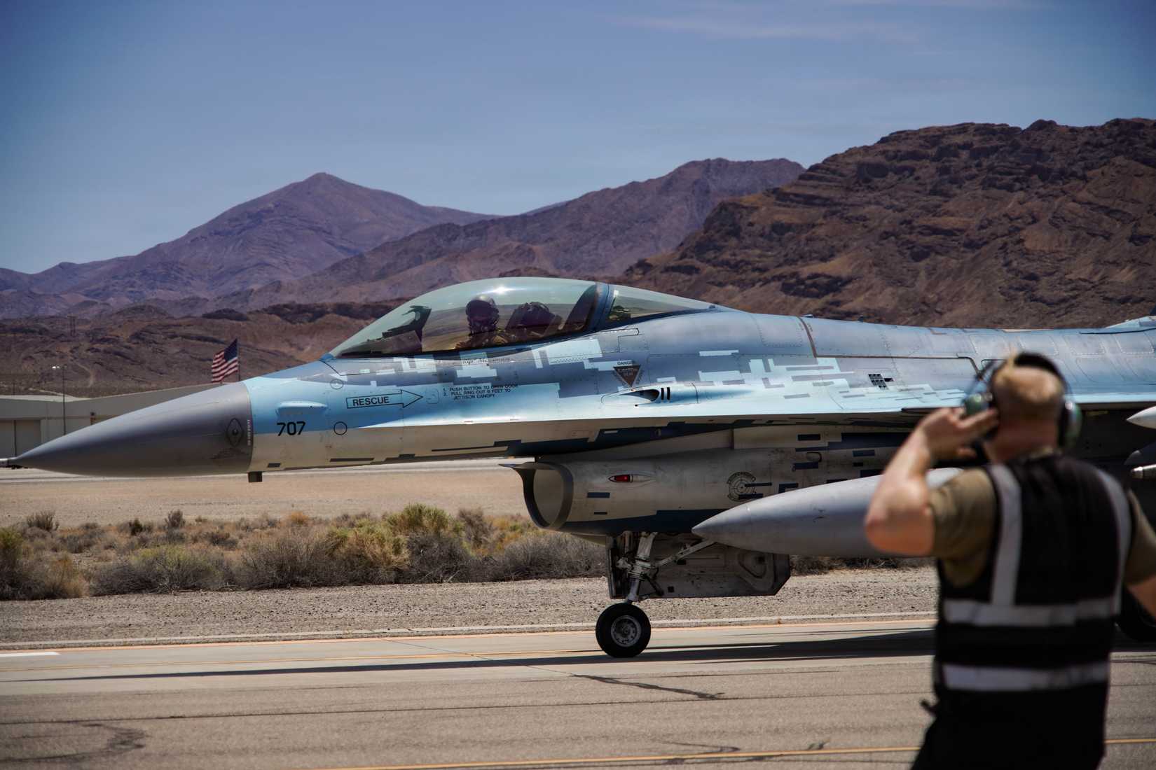 A U.S. Air Force F-16C Fighting Falcon aircraft assigned to the 64th Aggressor Squadron taxis to the runway during exercise VENOM FORGE at Creech AFB June 17, 2026
