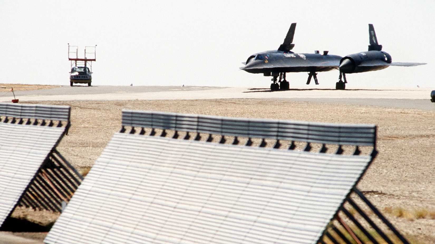 A view of an SR-71 Blackbird aircraft taxiing along the flightline.