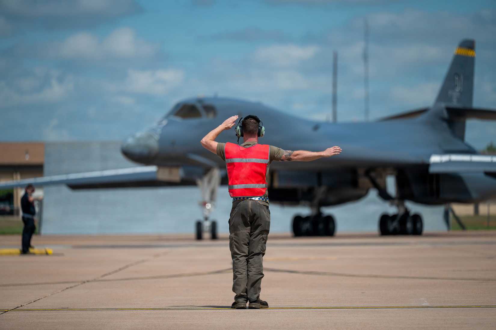 Air Force Airman 1st Class Trevor Francisco, 28th Bomber Generation Squadron assistant dedicated crew chief, taxis in a B-1B Lancer, tail number 86-0115, at Dyess Air Force Base