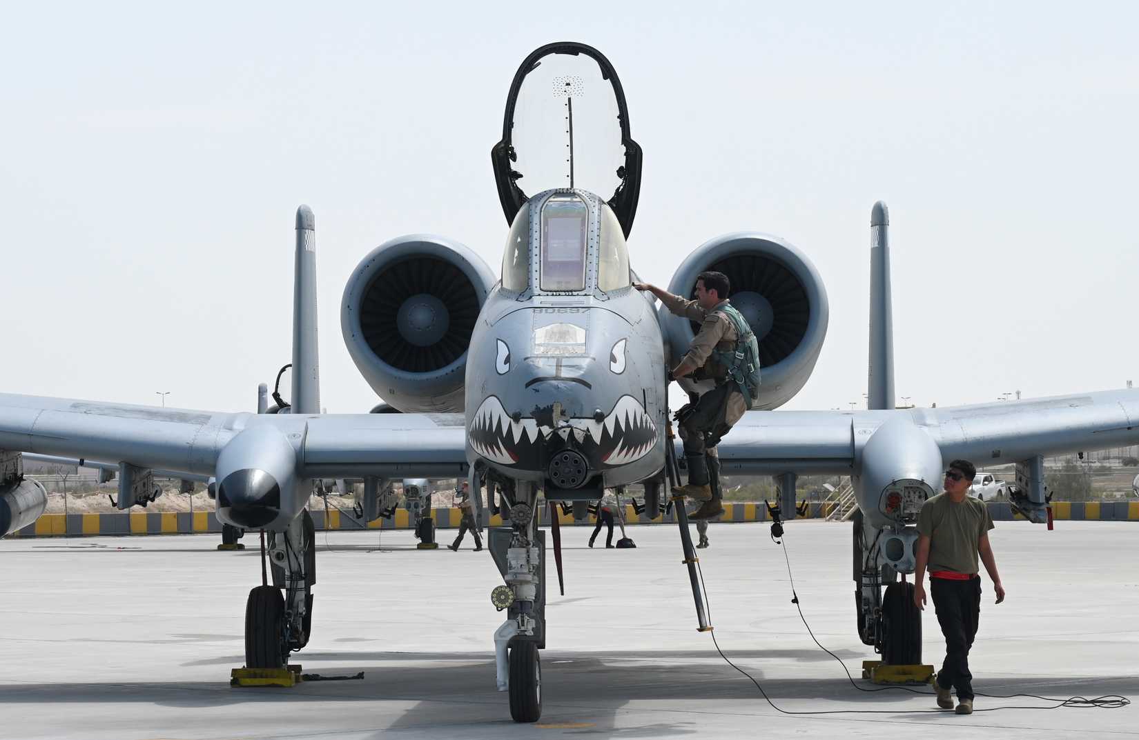 Air Force Maj. Daniel Harold, 75th Expeditionary Fighter Squadron pilot, climbs into the cockpit of an A-10 Thunderbolt II at Al Dhafra Air Base, United Arab Emirates