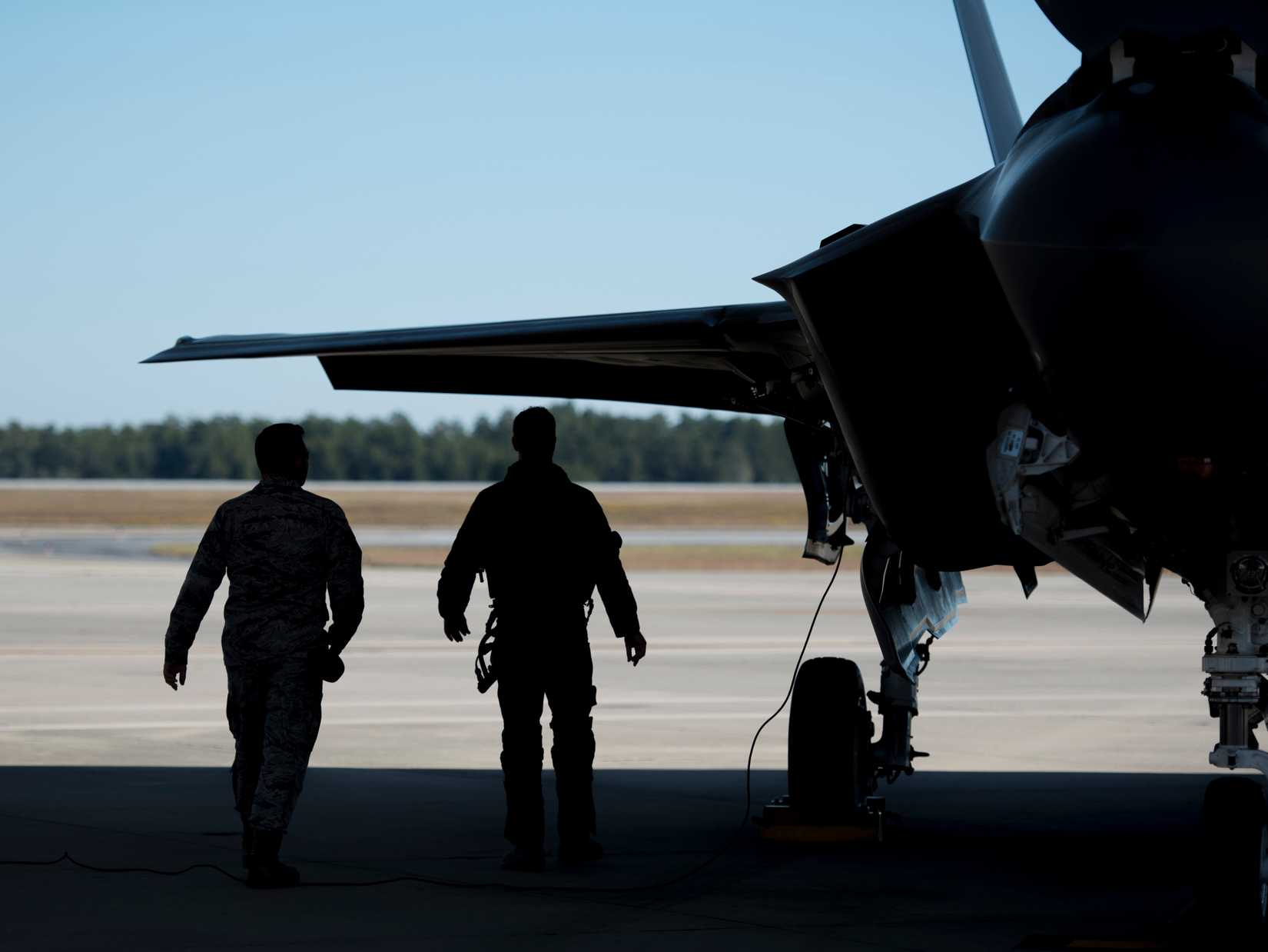 Air Force Staff Sgt. Jon Peek, 58th Aircraft Maintenance Unit crew chief, left, and Lt. Col. Jared Santos, 513th Electronic Warfare Squadron commander, inspect an F-35A Lightning II