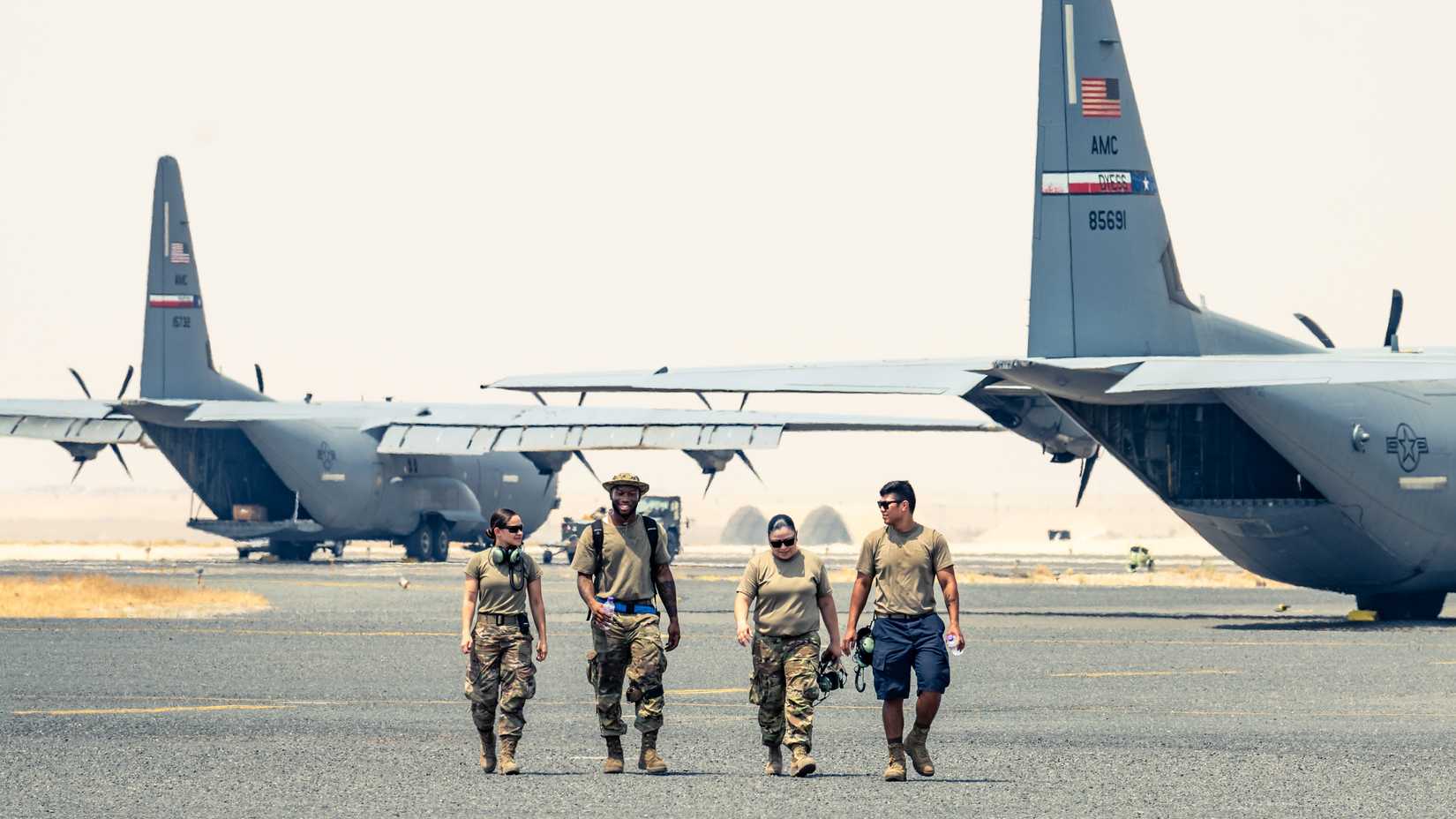 Airmen assigned to the 386th Expeditionary Aircraft Maintenance Squadron and the 386th Expeditionary Logistics Readiness Squadron leave the flightline